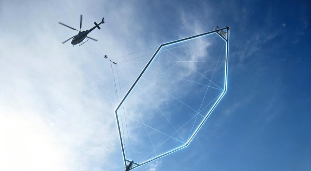 Low-angle view of SkyTEM helicopter conducting airborne electromagnetic survey against blue sky, towing large polygonal transmitter loop for subsurface mineral exploration.